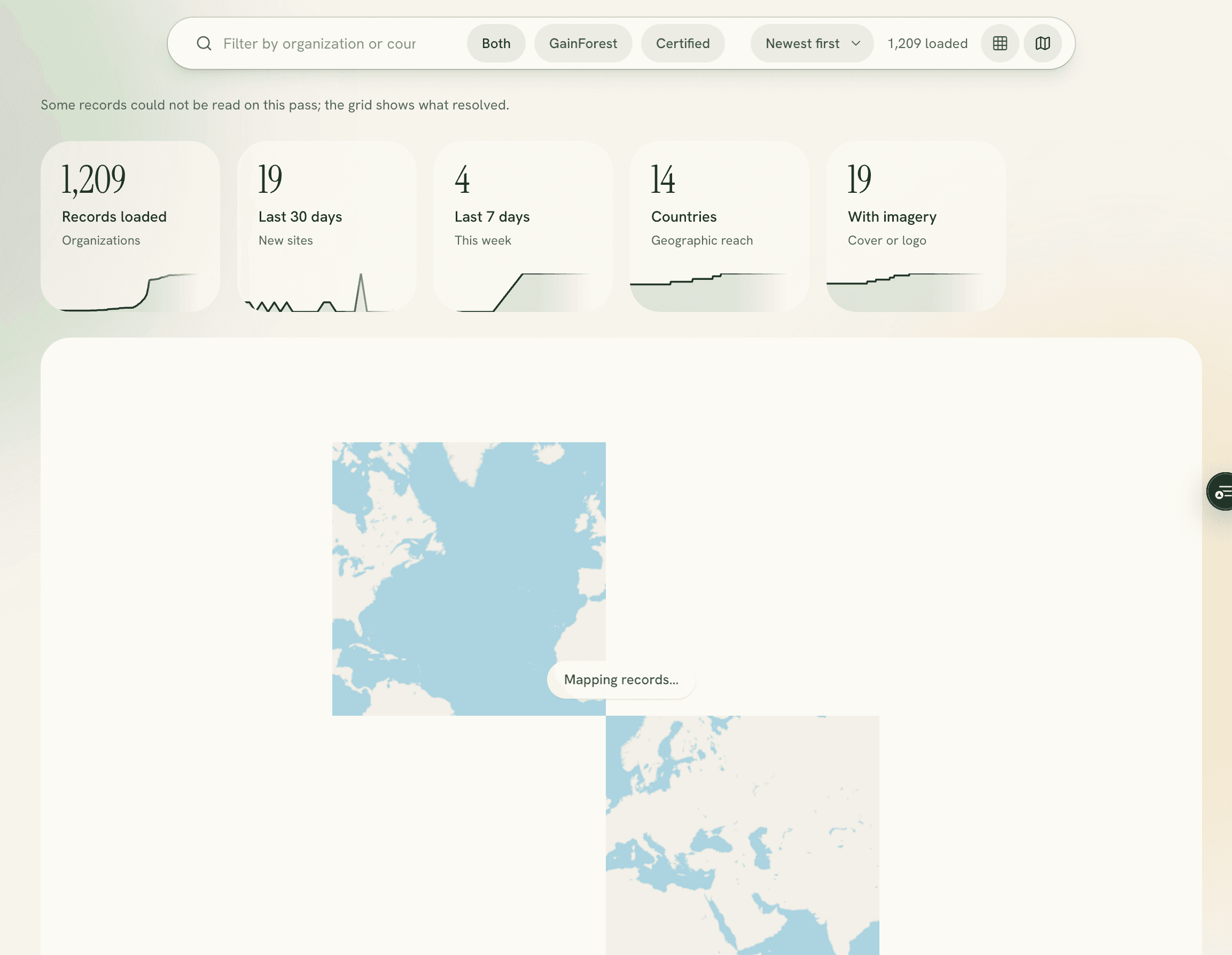 The organisations map view with a partly painted basemap, one tile of the world rendered in the middle of an otherwise empty panel, and a Mapping records chip.